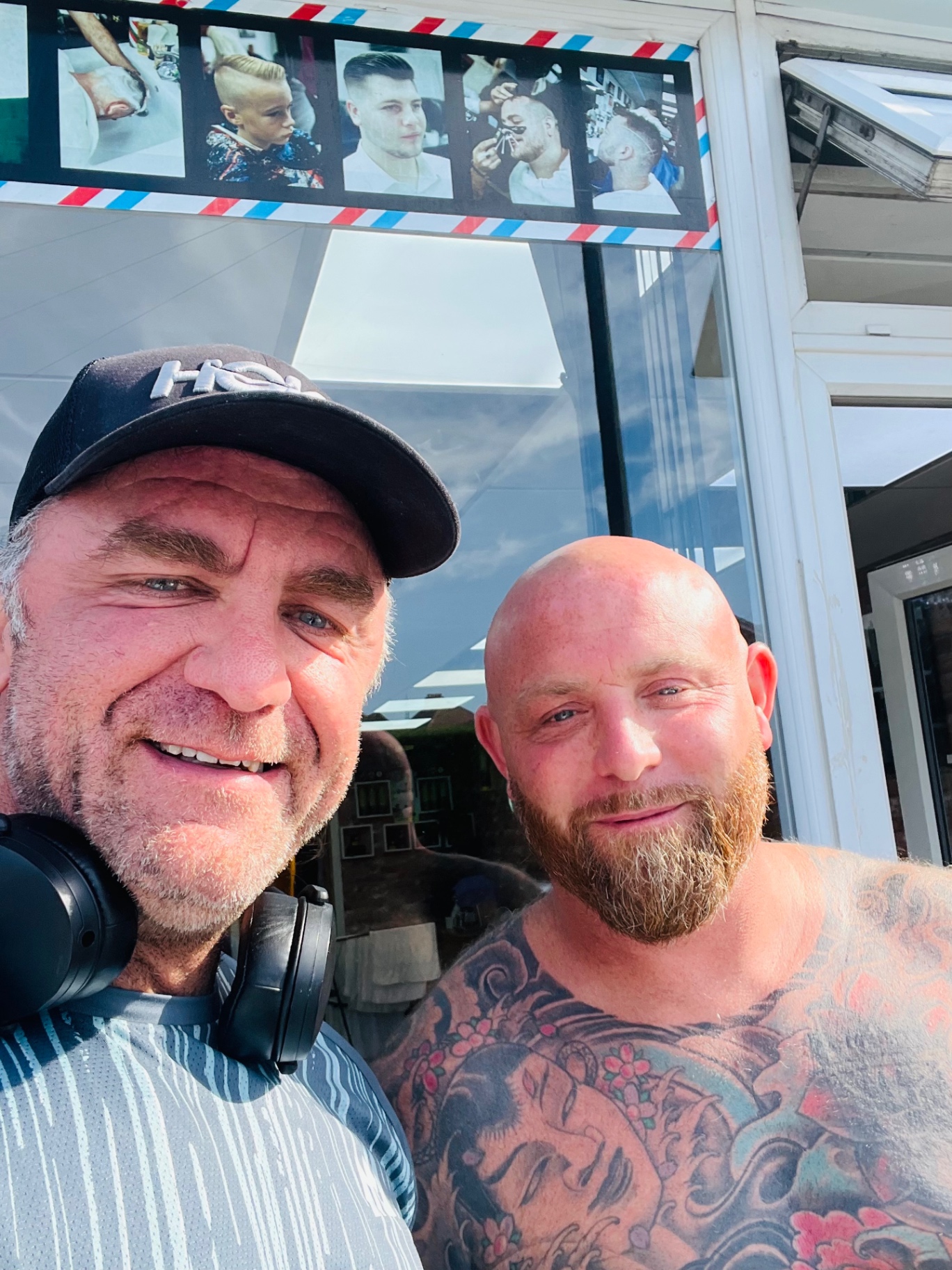 Rob with a supporter outside a barber shop during 4x4x72, June 2026